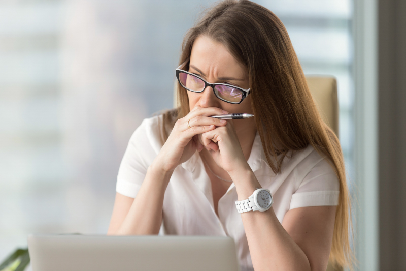 Upset women sitting at desk